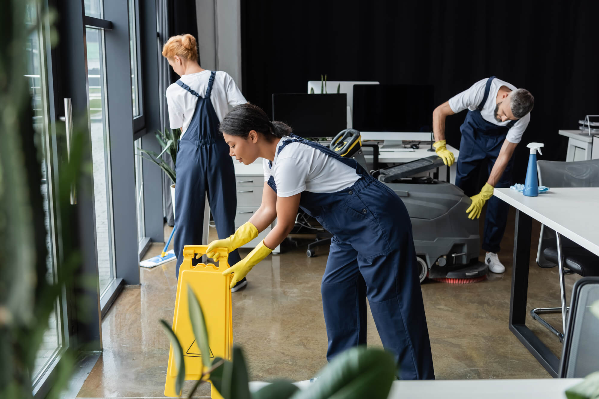 three people cleaning