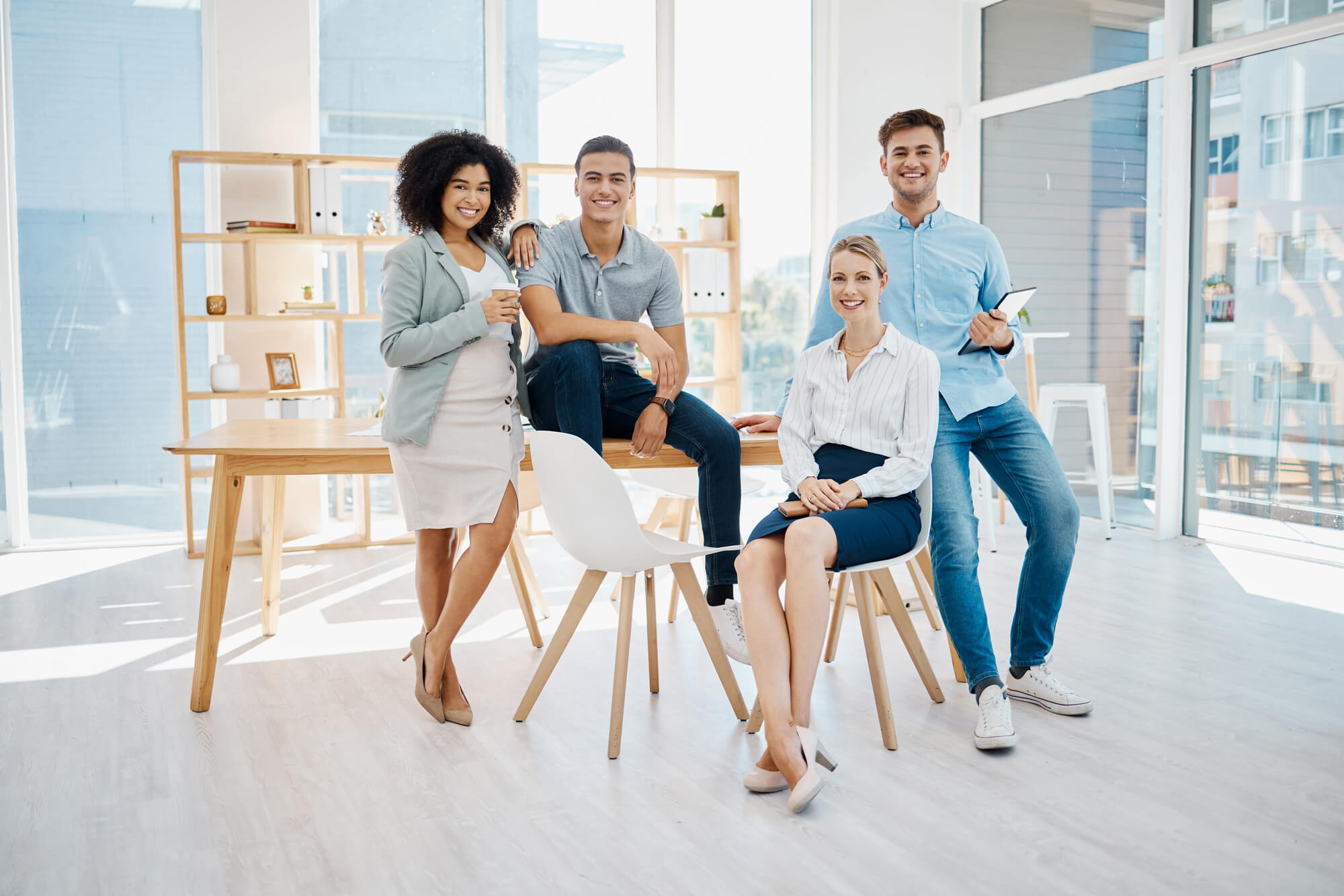 four people smiling