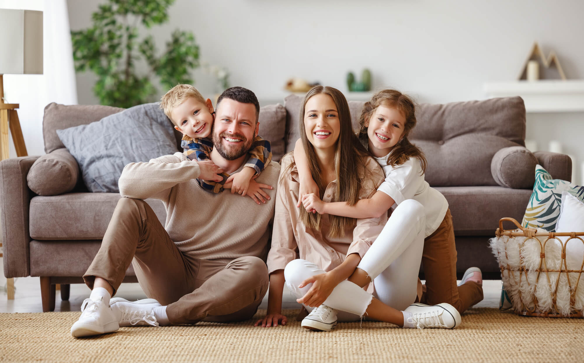 family of four smiling